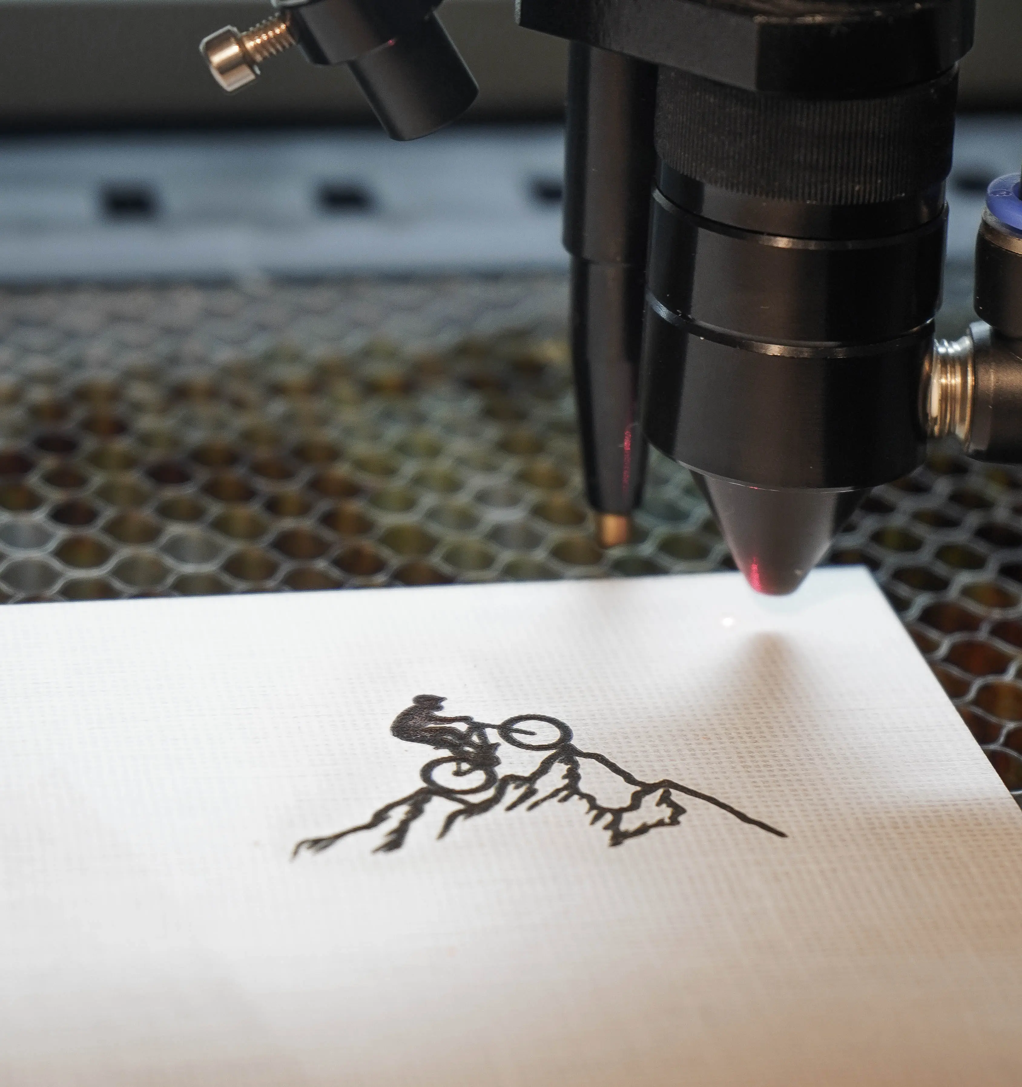 Laser engraving a custom design in the KORA workshop