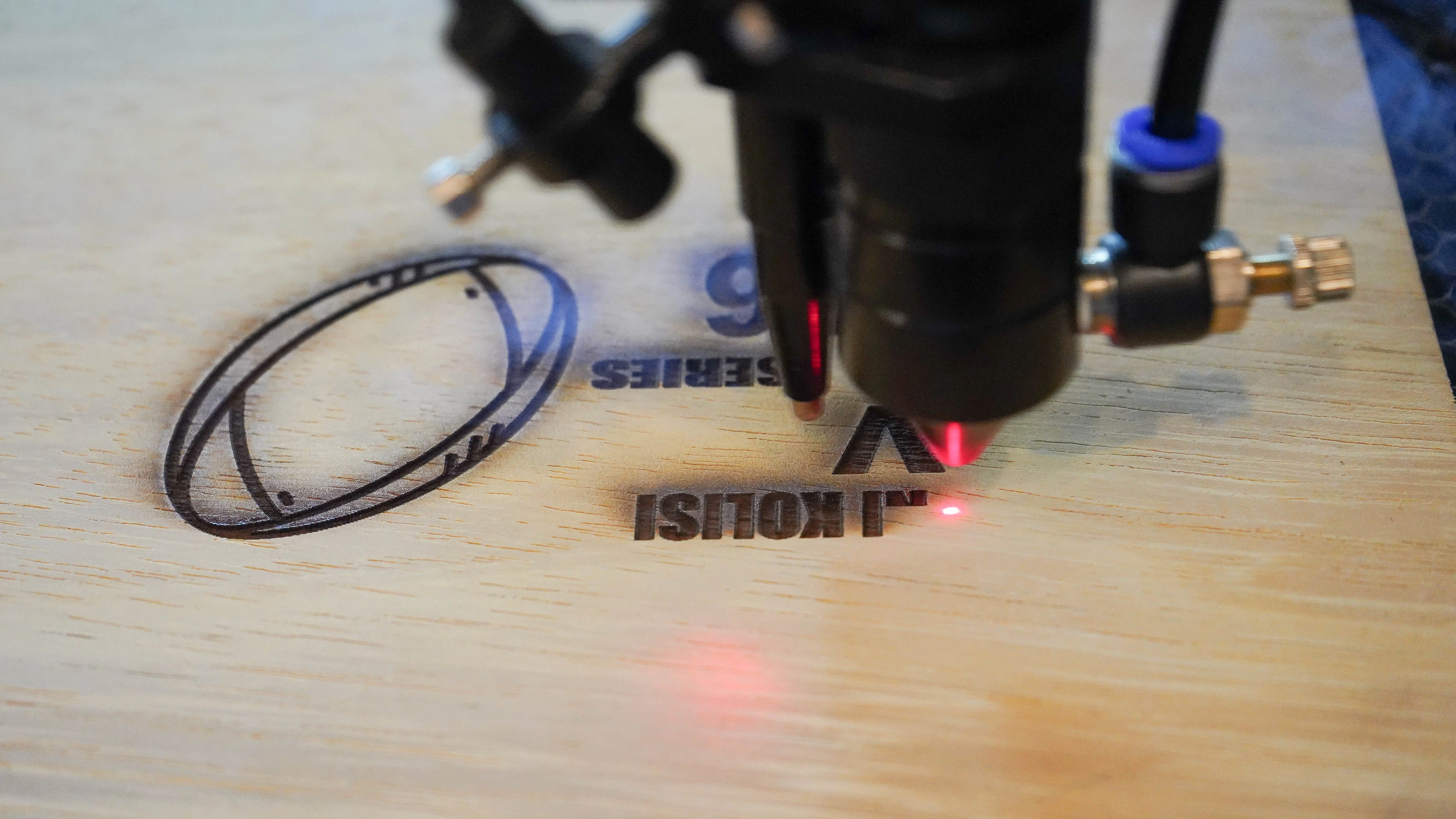 Laser engraving a custom design in the KORA workshop